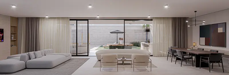 Living integrado ao jardim por grandes portas de vidro
